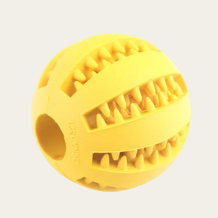Balle distributrice de friandises Pelorie jaune en TPR avec picots pour stimuler et ralentir l'alimentation du chien