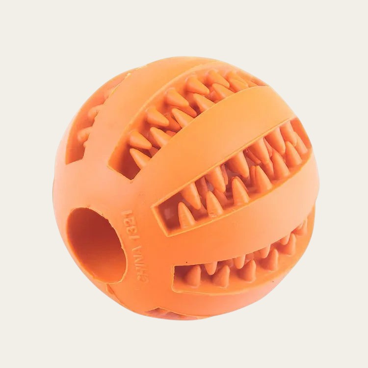 Balle distributrice de friandises Pelorie orange en TPR avec picots internes pour stimuler et ralentir le chien