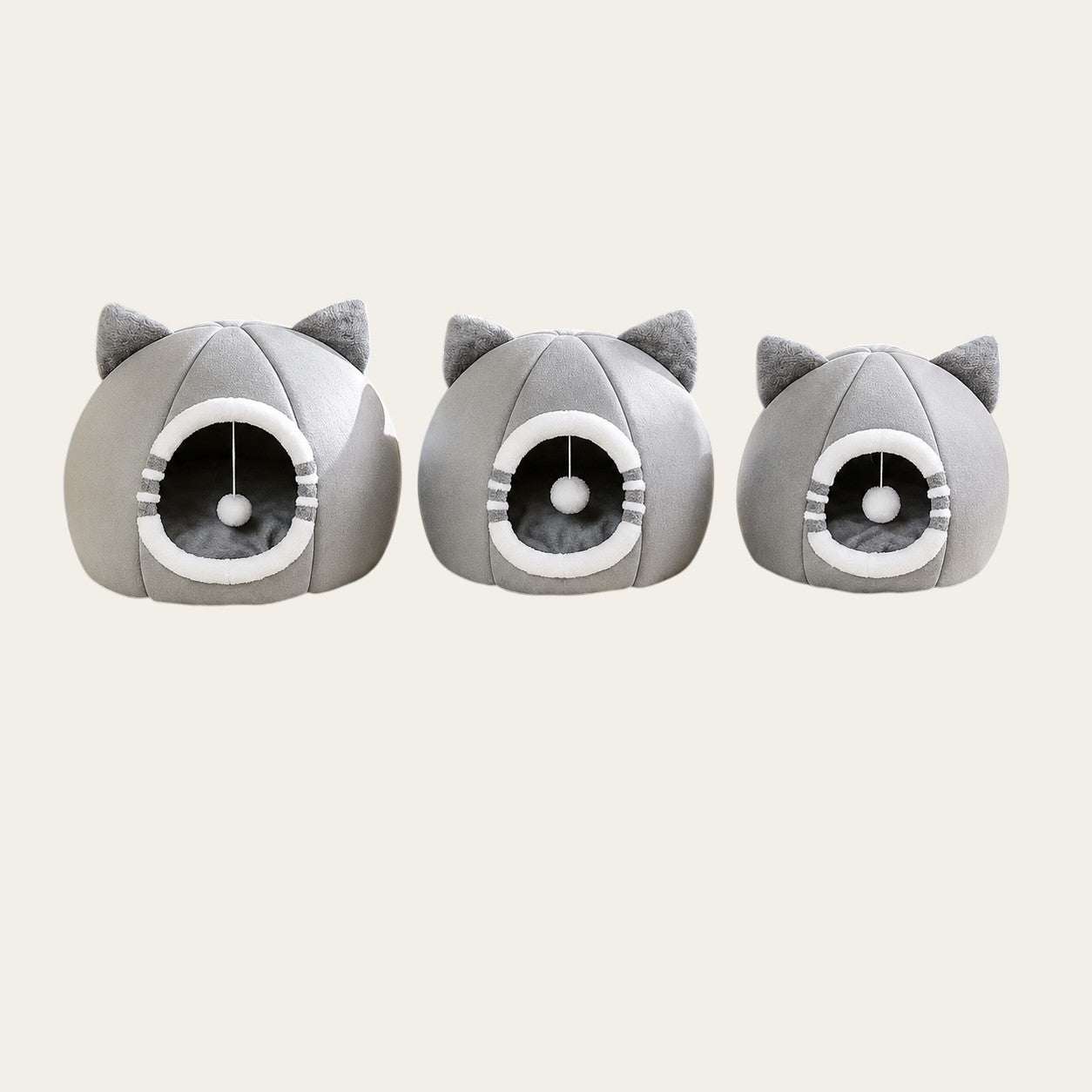 Trois niches Pelorie grises en forme de tête de chat avec oreilles, jouet suspendu et intérieur douillet