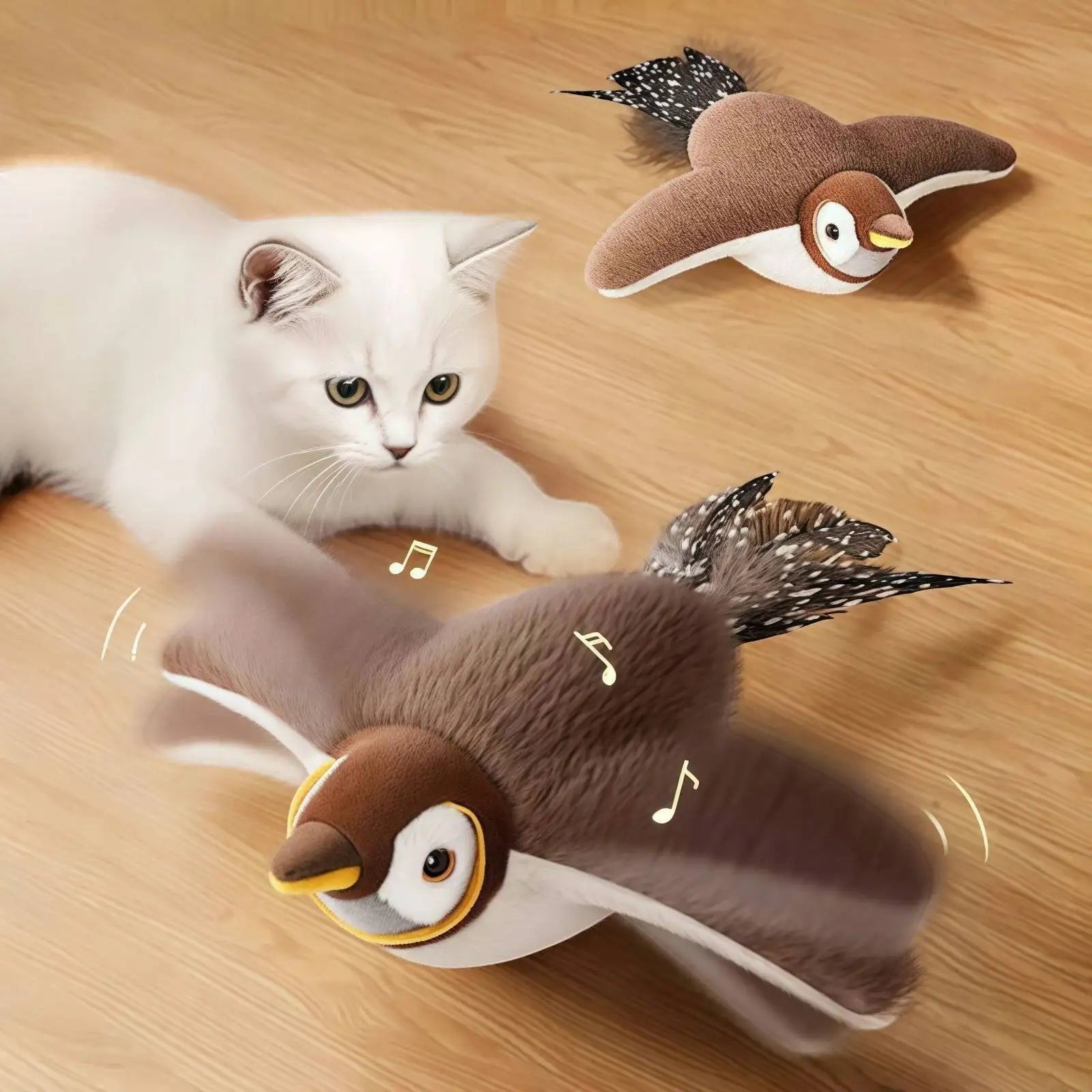 Chat blanc jouant avec un oiseau interactif en peluche Pelorie aux ailes mobiles et effets sonores sur un sol en bois